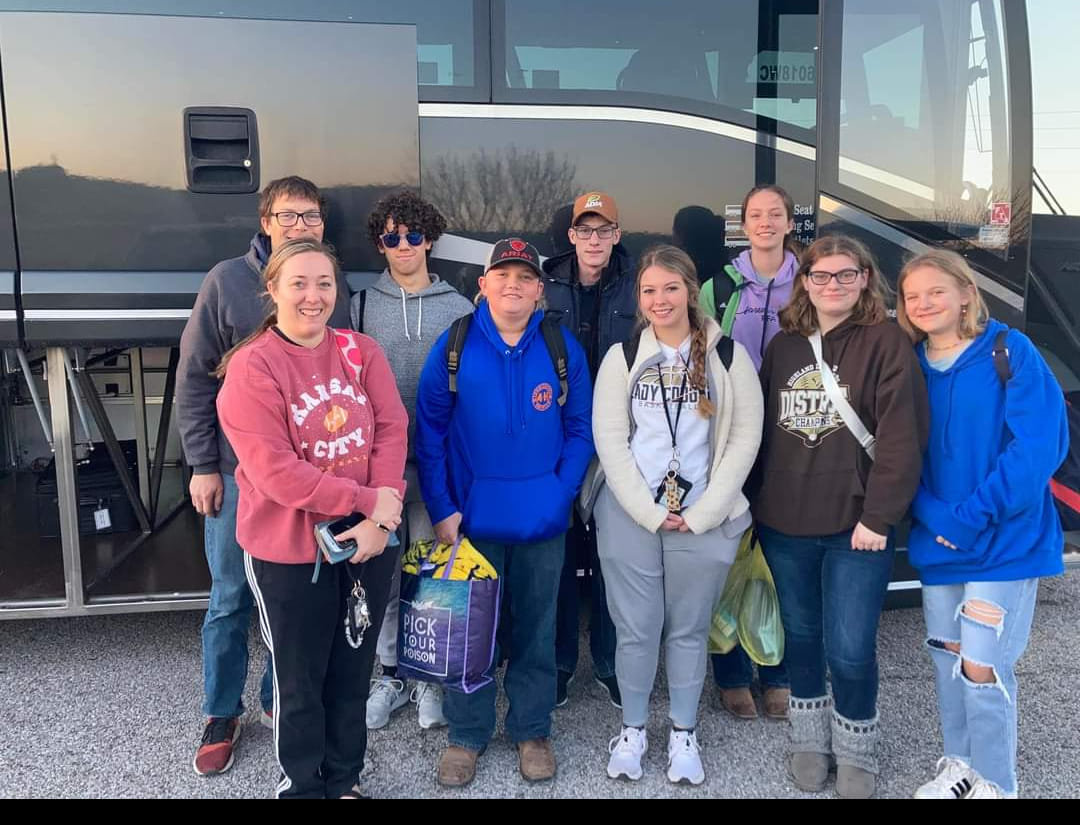 a Groups of high school teens and their chaperones from Queen of Peace Parish in Ewing stops for a photo during their trip to Indianapolis to attend the National Catholic Youth Conference.